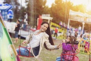 Mother and daughter at amusement park